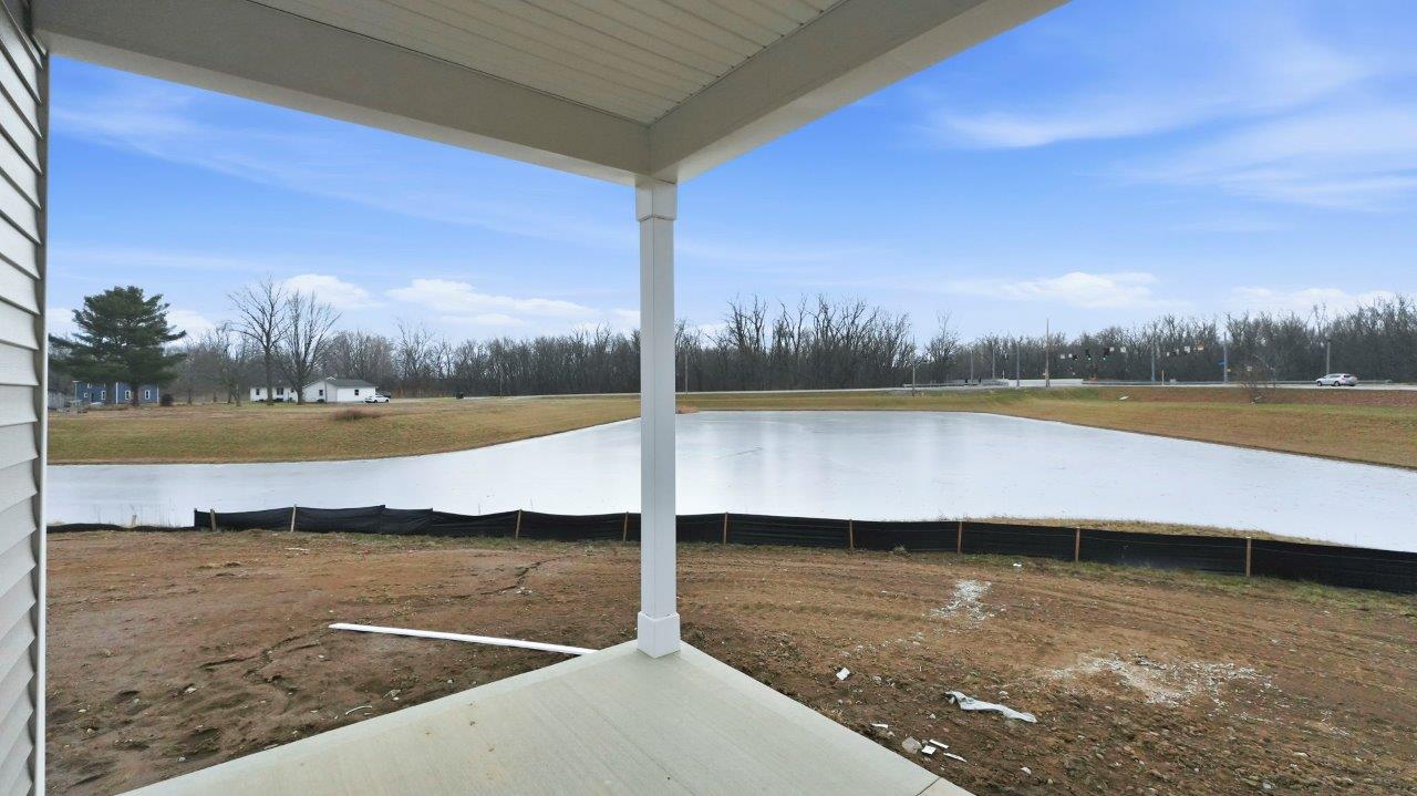 chatham rear exterior with covered patio with pond view