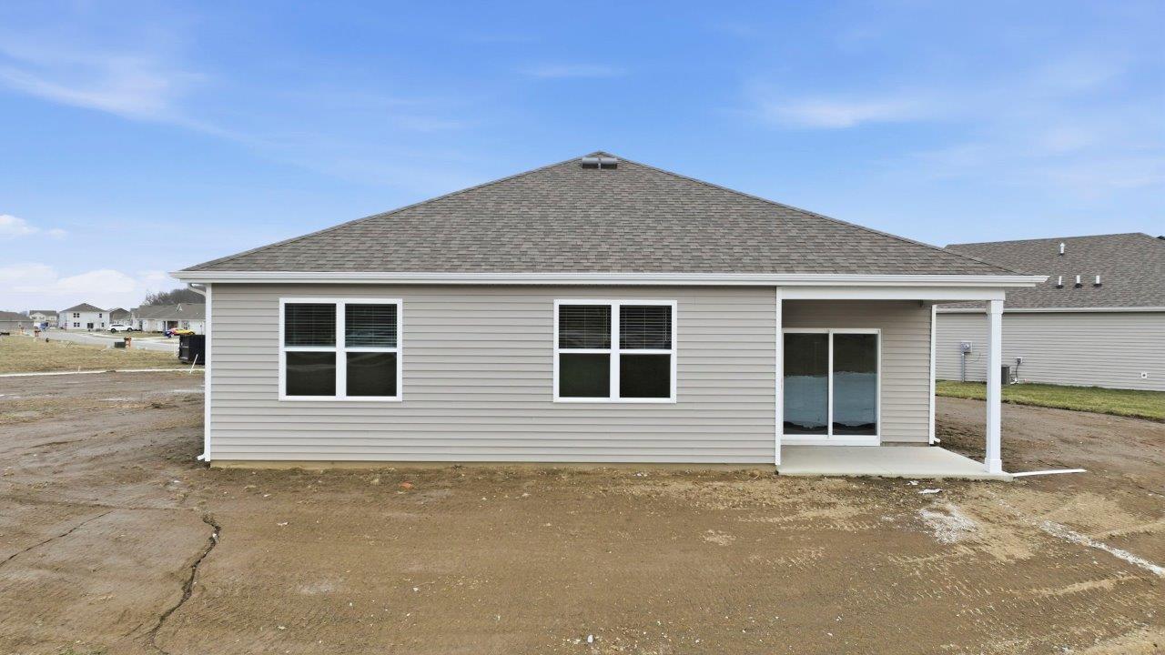 chatham rear exterior with covered patio with pond view