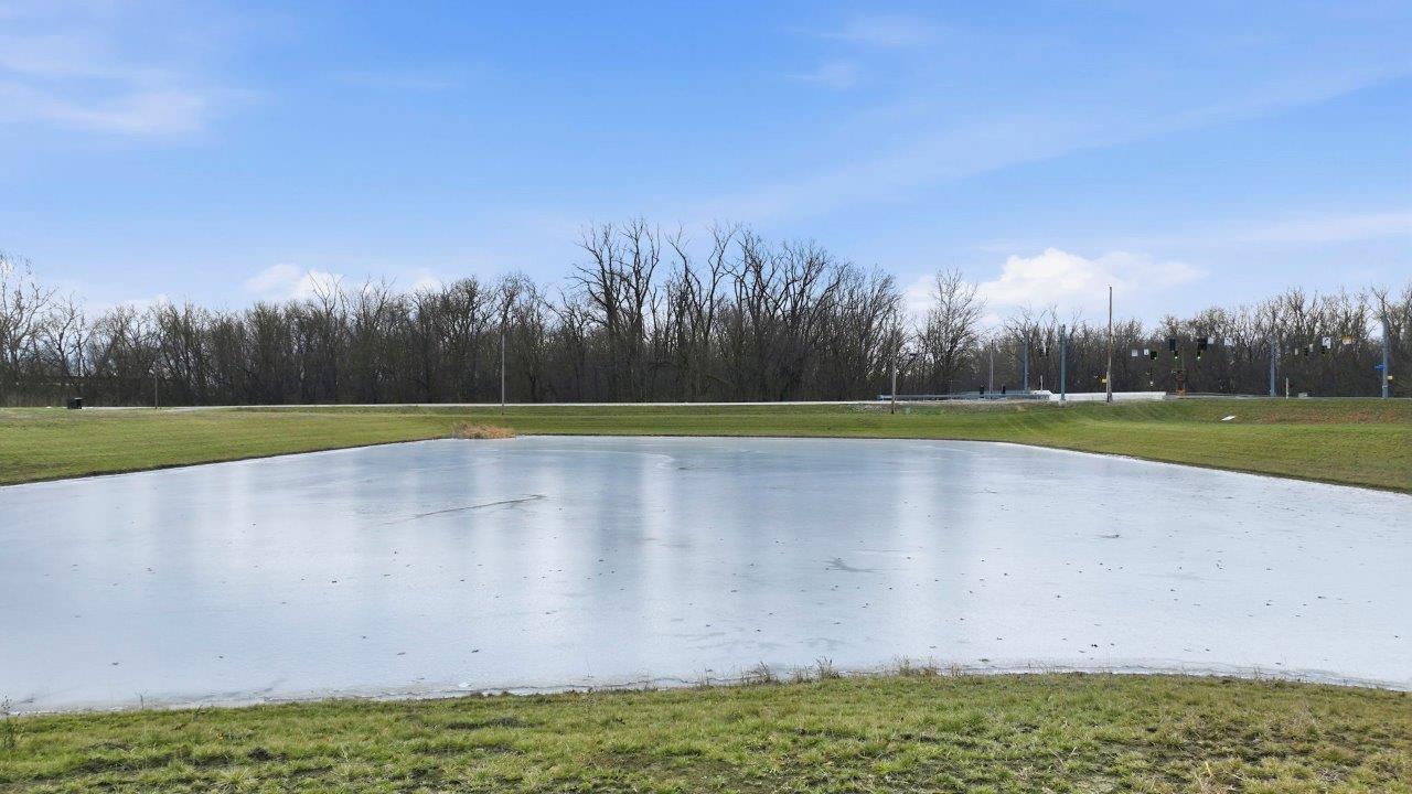 chatham rear exterior with covered patio with pond view