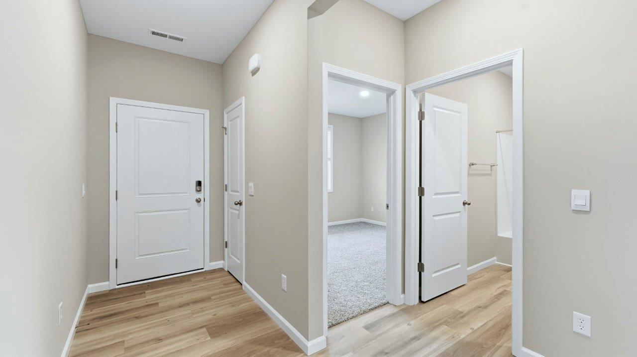 front door with main hallway with lvp flooring