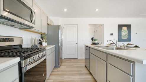 Grasslands at Broad Acres Bellamy Model kitchen with stainless steel appliances