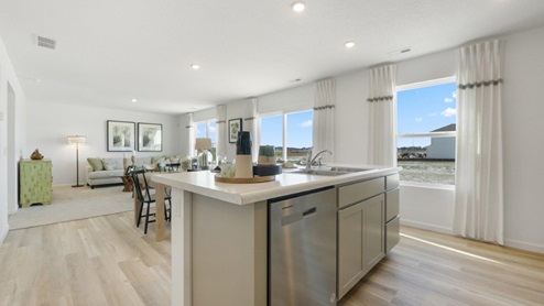 Grasslands at Broad Acres Bellamy Model open floorplan kitchen, dining, and living room