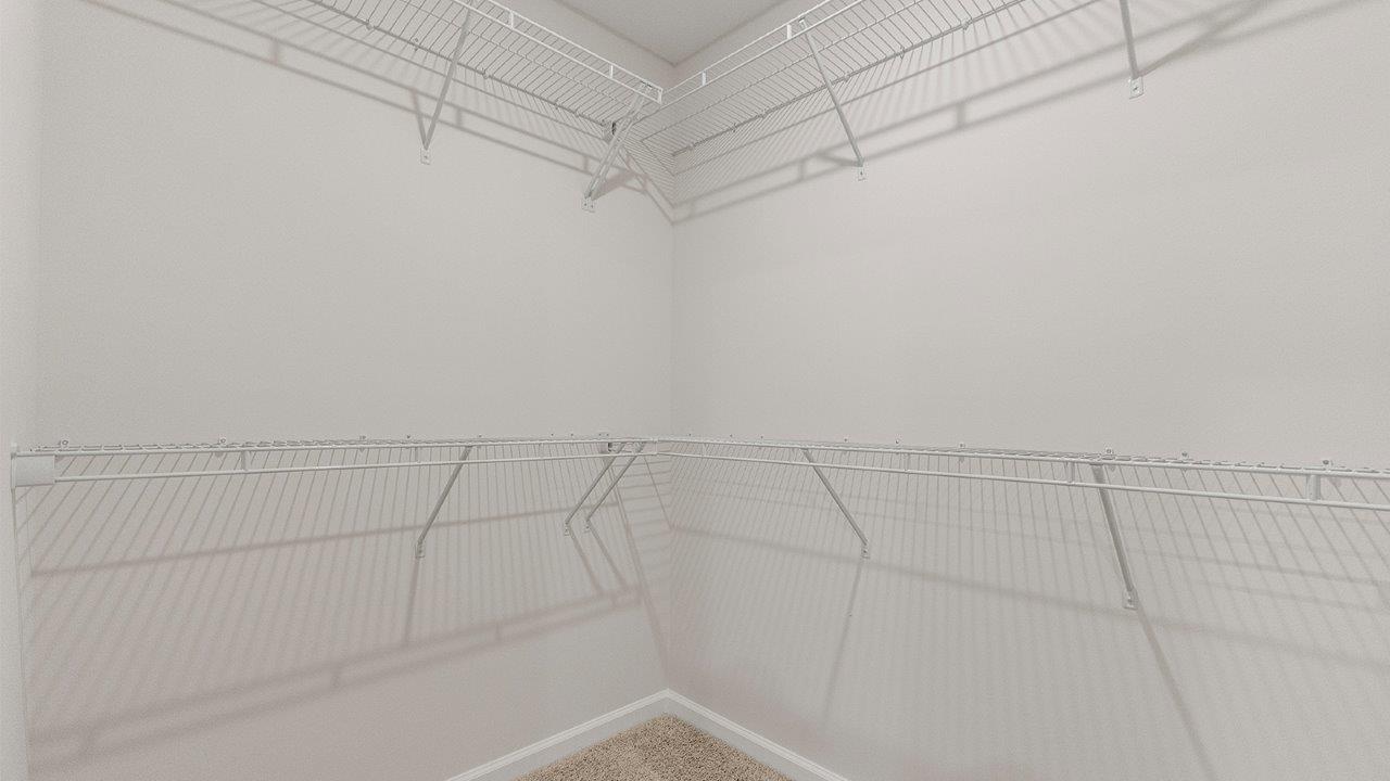 primary ensuite closet with shelving built-in