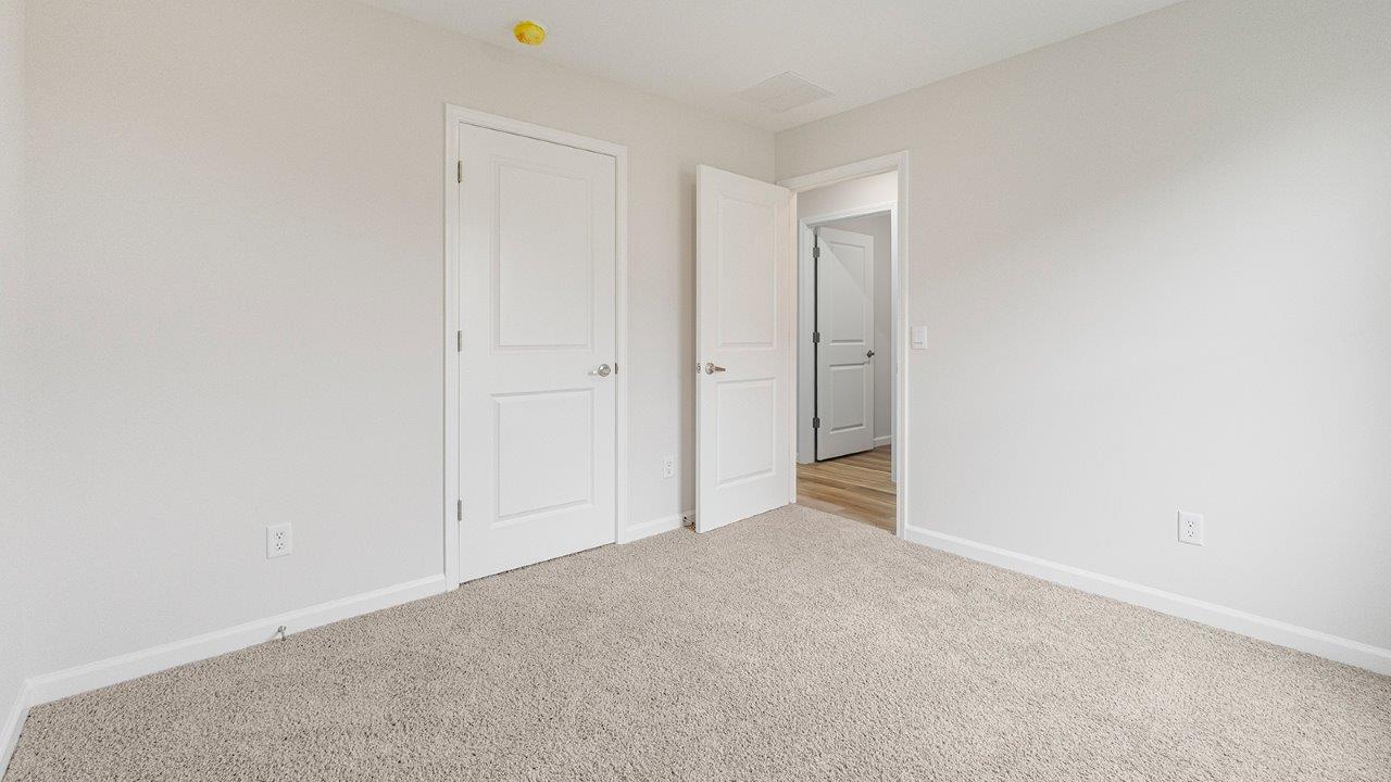 bedroom 2 with carpet flooring, closet, and 1 window