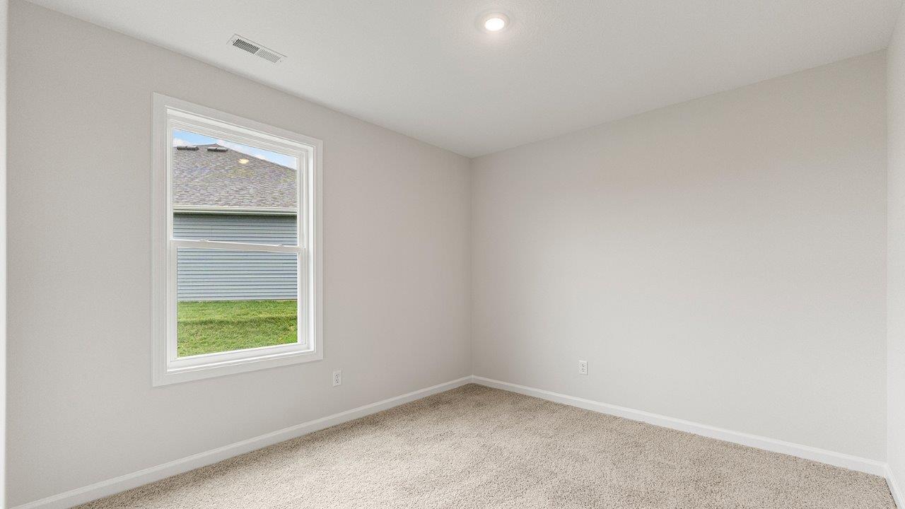 bedroom 2 with carpet flooring, closet, and 1 window