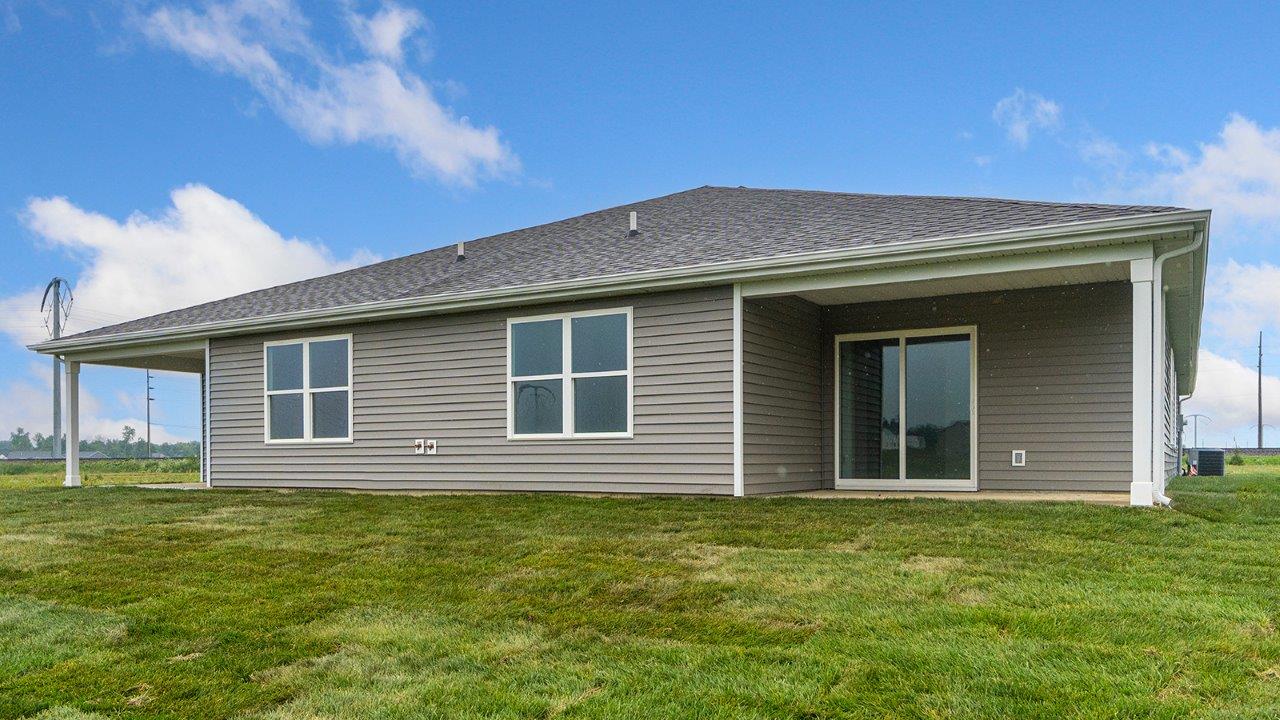 olsen exterior with backyard covered patio with sodded yard