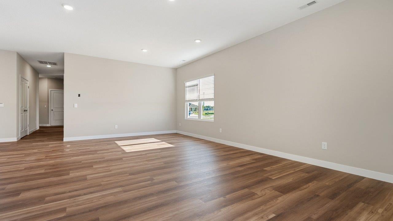 livingston lakes paired villas olsen open layout living room with mohawk luxury vinyl plank flooring and natural lighting