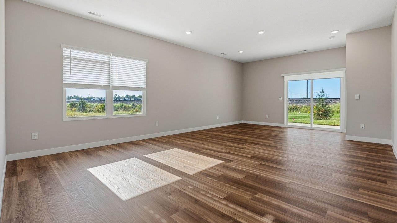 livingston lakes paired villas olsen open layout living room with mohawk luxury vinyl plank flooring and natural lighting