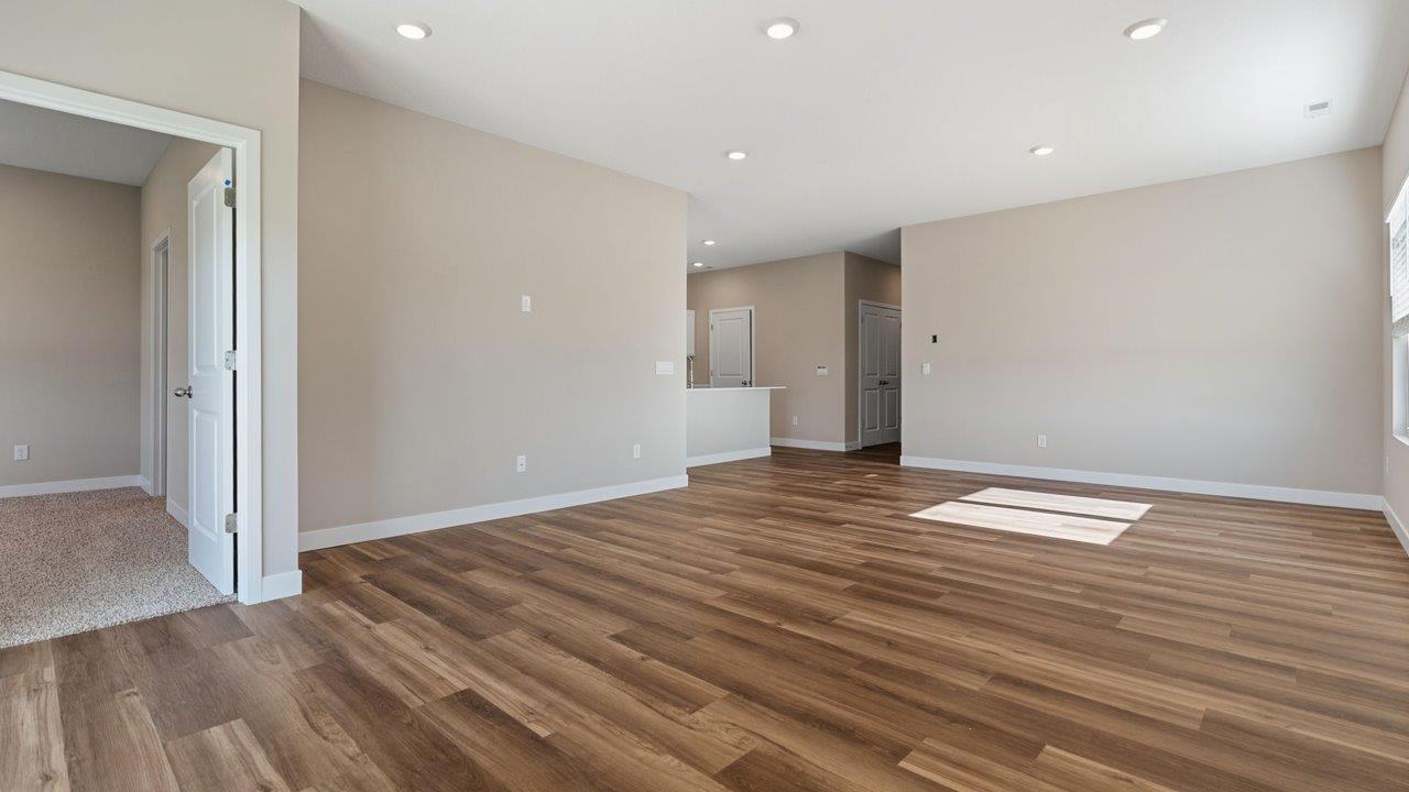 livingston lakes paired villas olsen open layout living room with mohawk luxury vinyl plank flooring and natural lighting