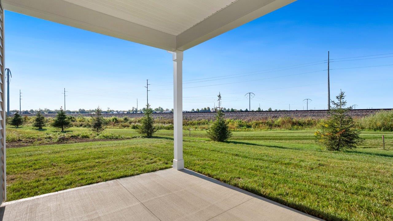 livingston lakes paired villas olsen backyard covered patio with sliding glass door and sodded yard
