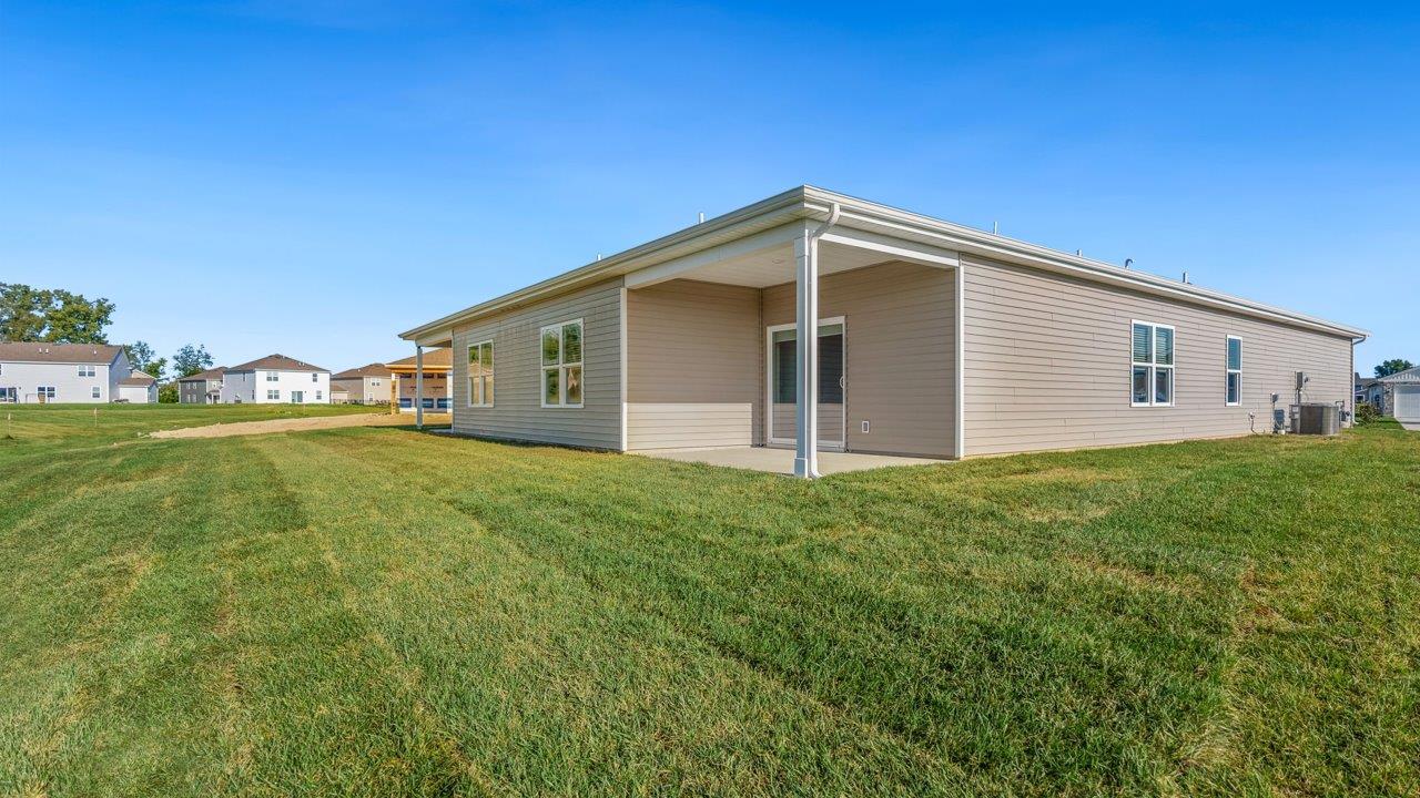 livingston lakes paired villas olsen backyard covered patio with sliding glass door and sodded yard