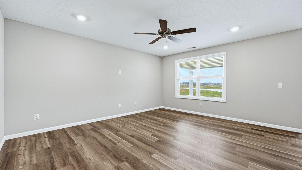 living room with mohawk eastmont lvp flooring, ceiling fan, and popular grey walls