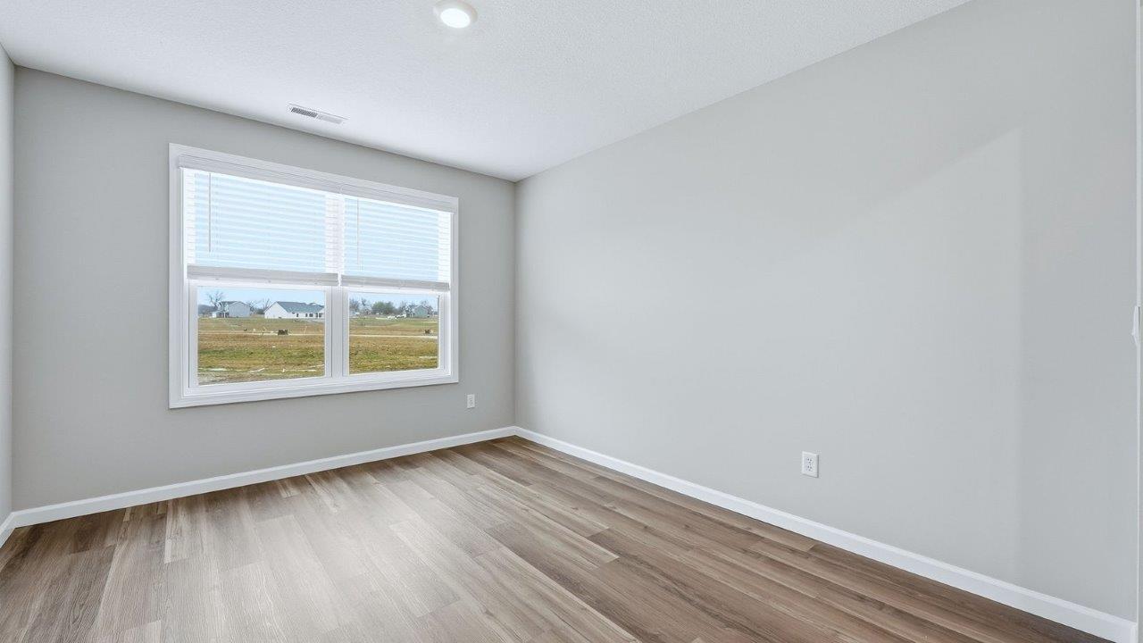 living room with mohawk eastmont lvp flooring, ceiling fan, and popular grey walls