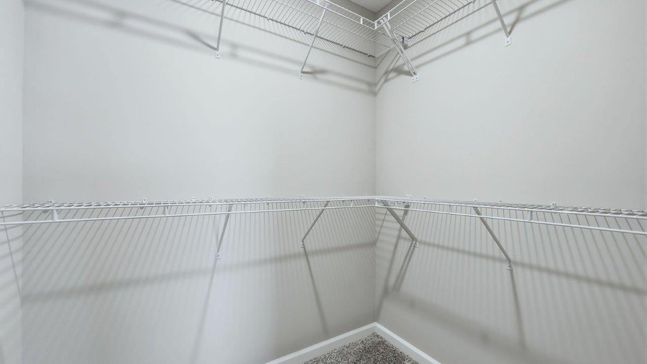 kitchen walk-in corner pantry with shelving built-in