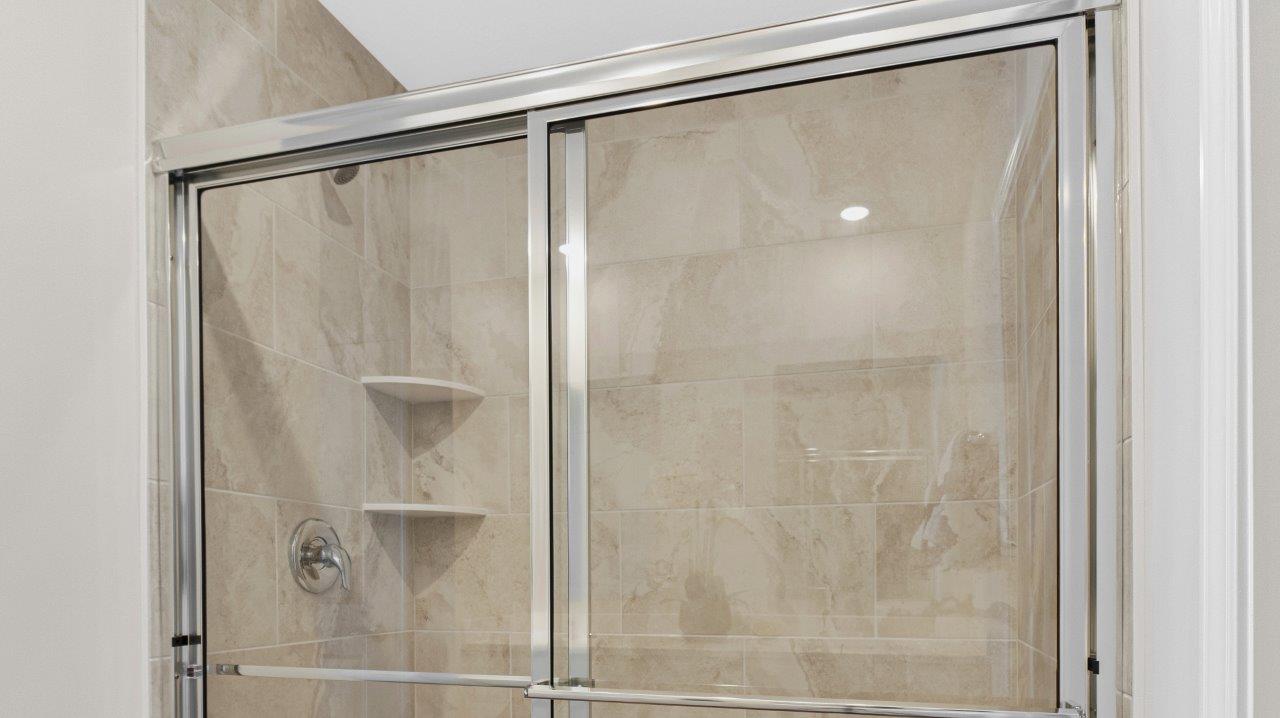erie primary bath with tile walk in shower