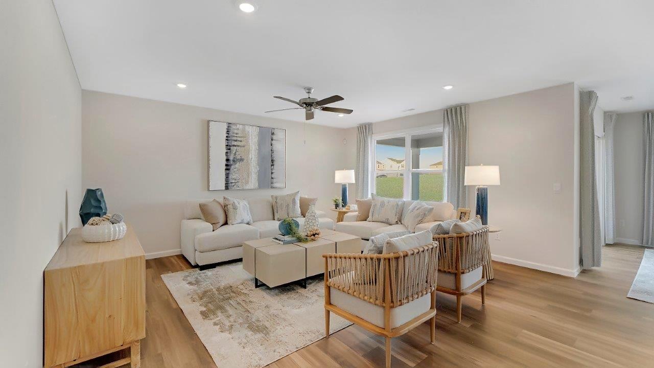 erie living room with lvp flooring and fan