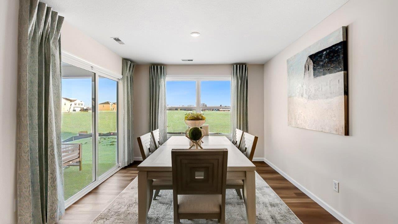 erie dining room with sliding door to covered backyard patio