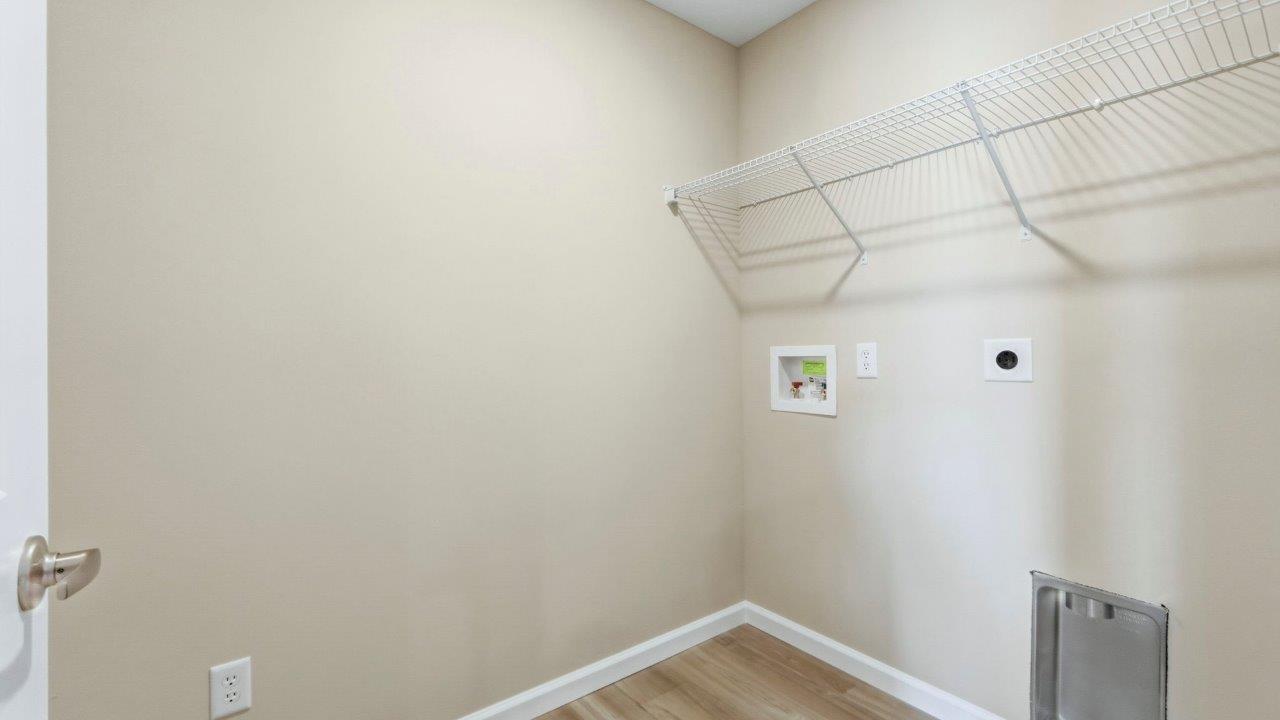laundry room with hookups and shelving built-in