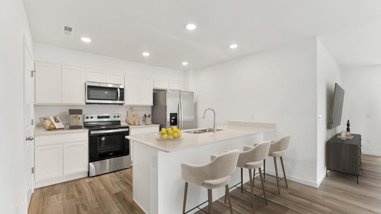 olsen kitchen with white cabinets and quartz counters