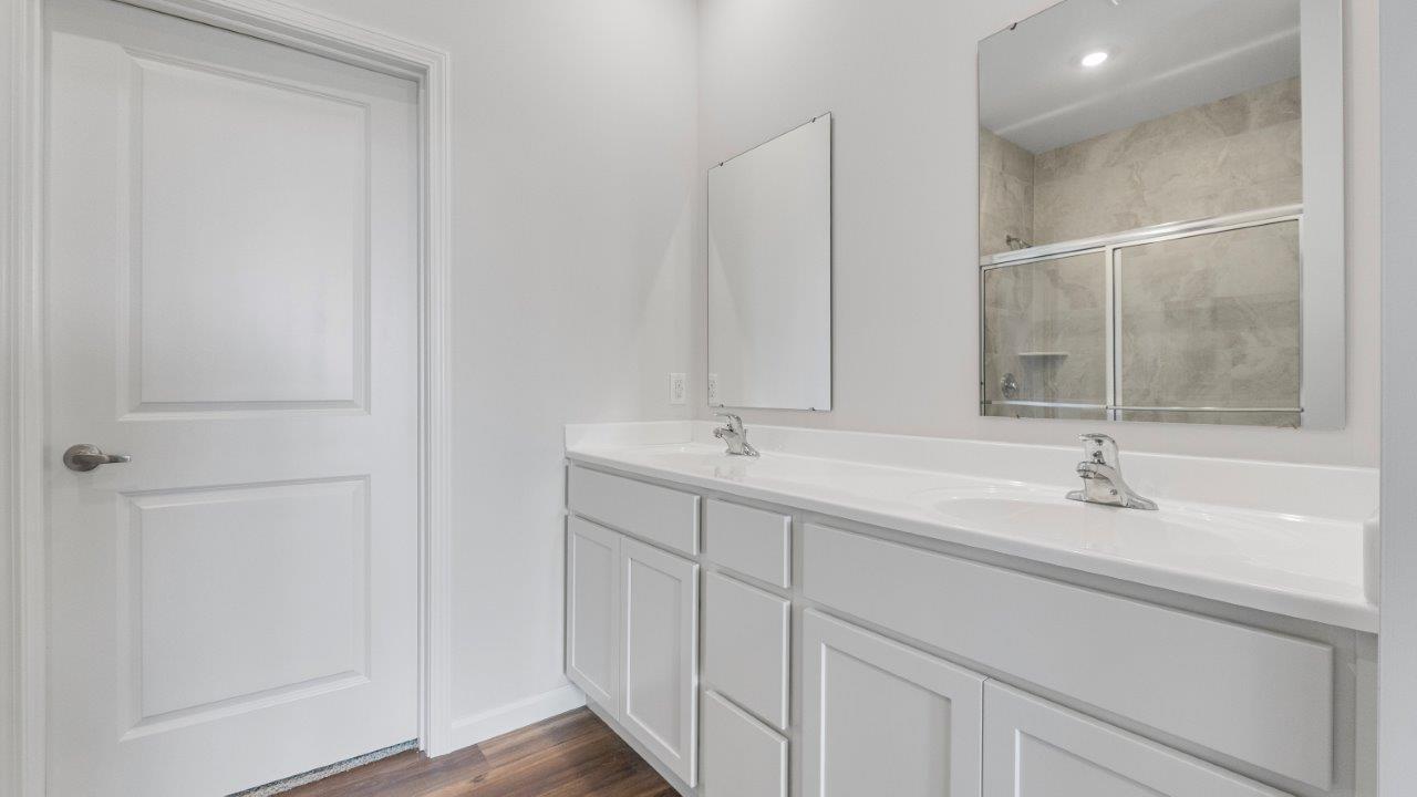 kennebec paired villa erie primary bedroom ensuite bath with dual sinks