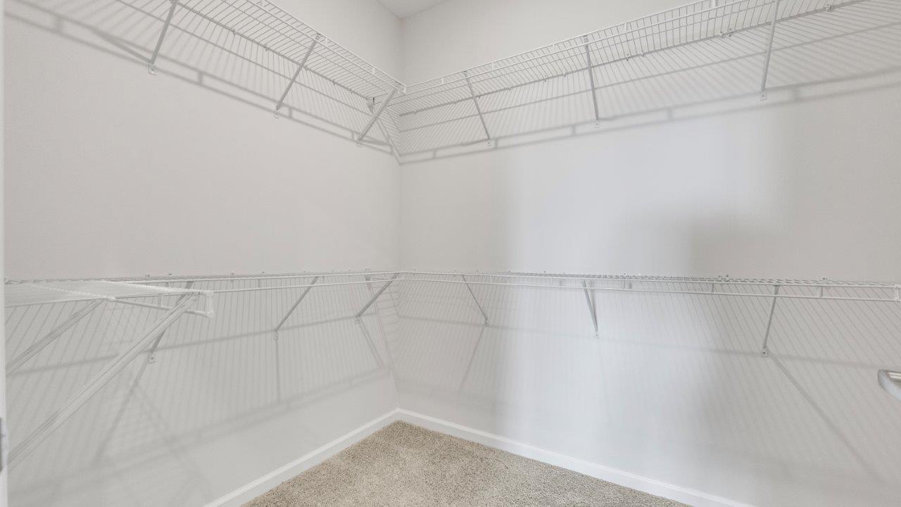 kennebec paired villa erie primary bedroom ensuite walk in closet