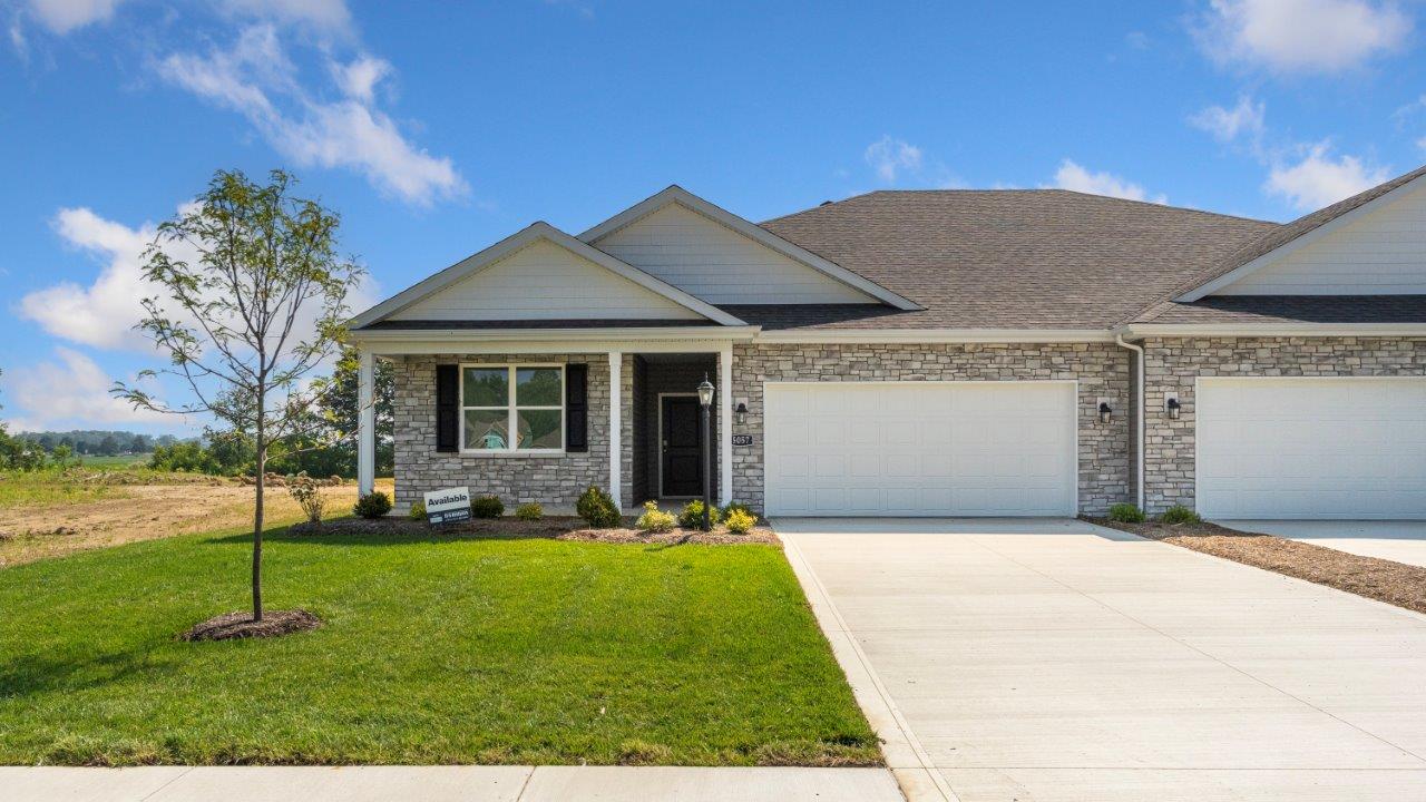 kennebec paired villa erie exterior with landscaping and sod