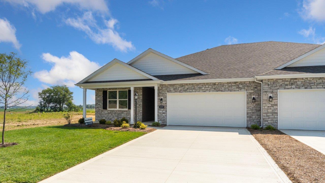 kennebec paired villa erie exterior with landscaping and sod