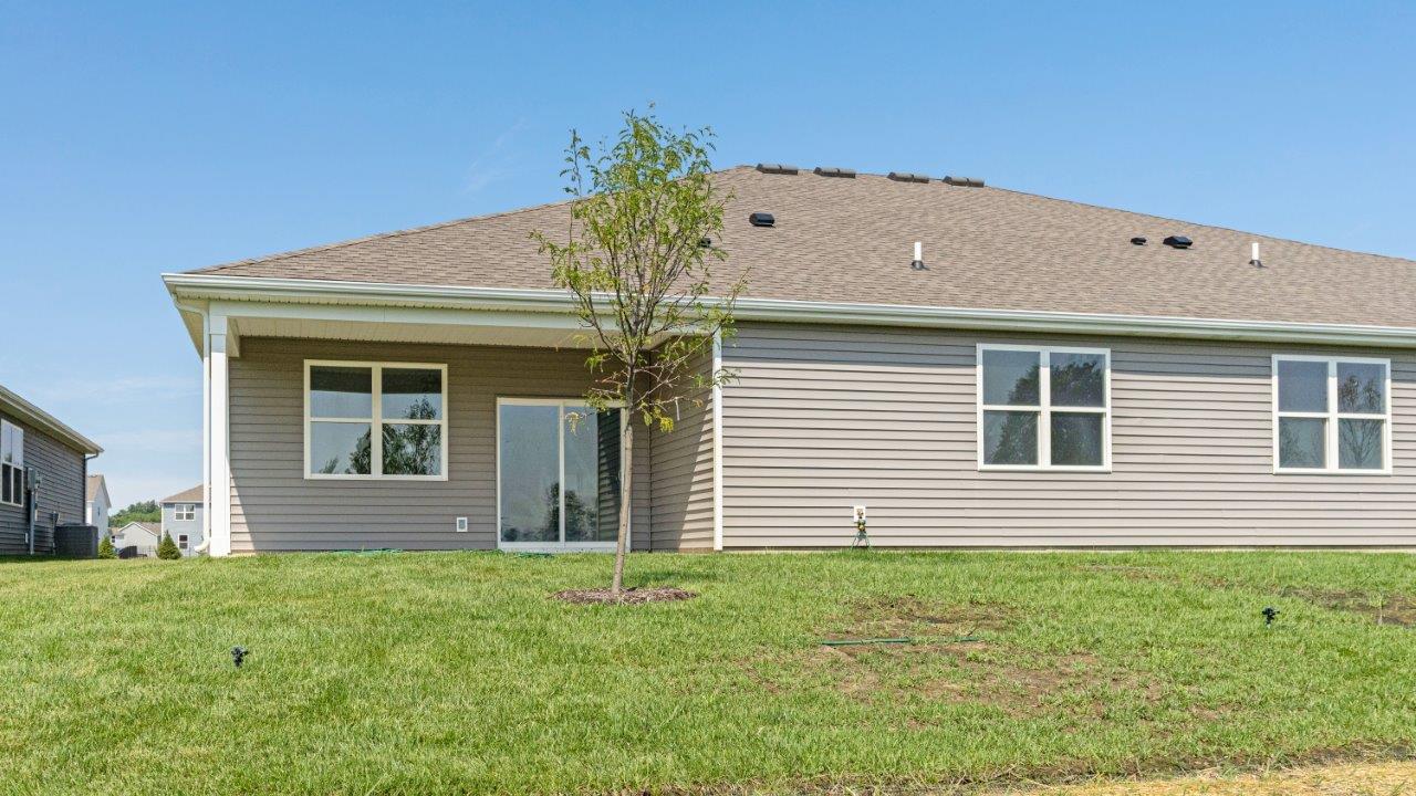 kennebec paired villas wabash exterior with covered patio and sod yard