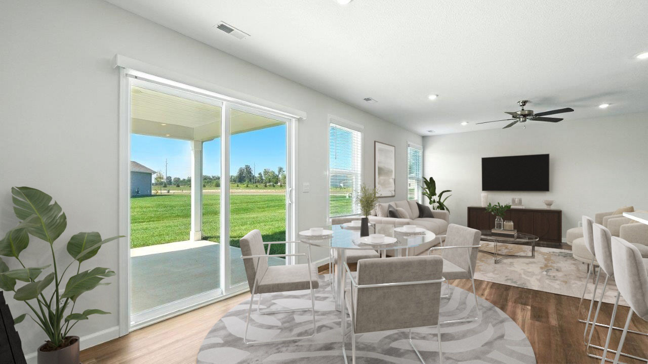 hardin dining space with lvp and sliding glass door to backyard