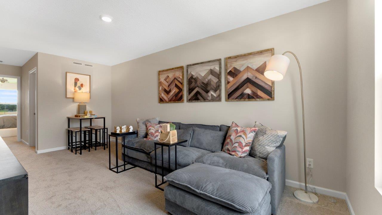 loft with carpet flooring, window, and popular grey walls