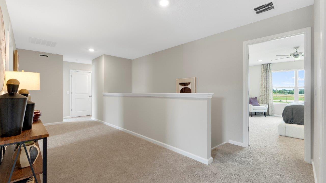 second floor stair landing with carpet flooring