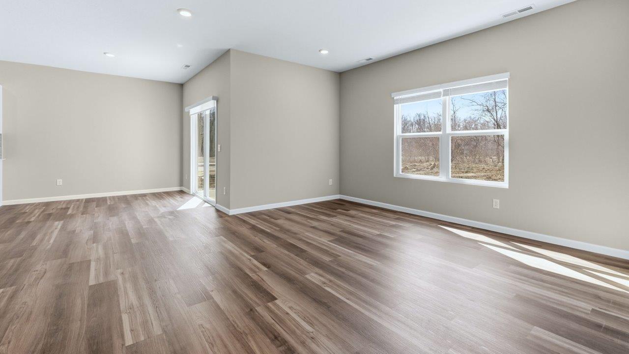 dining room with lvp flooring and sliding glass door to backyard patio