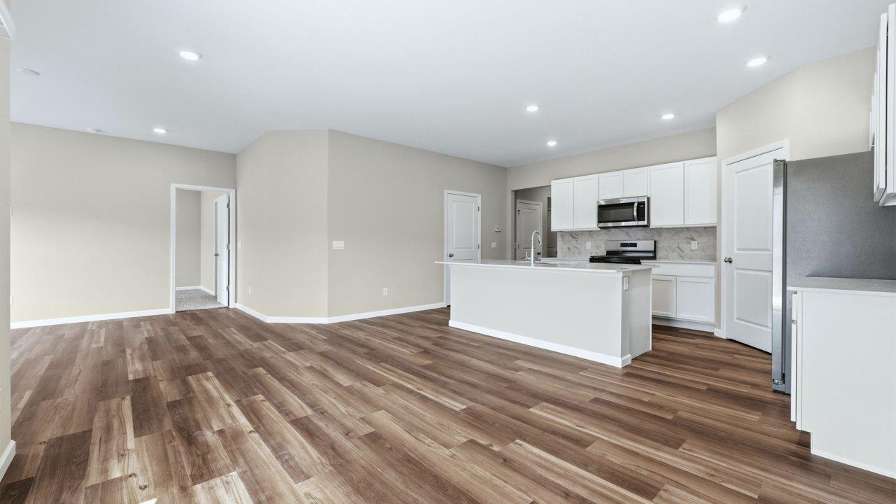 open plan kitchen, living room, and dining room