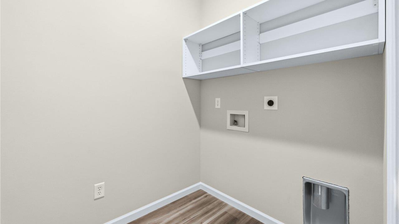 laundry room with built-in shelving