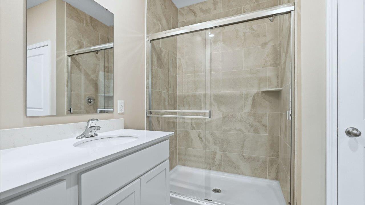 primary ensuite walk-in bathroom with ceramic tile walk-in shower