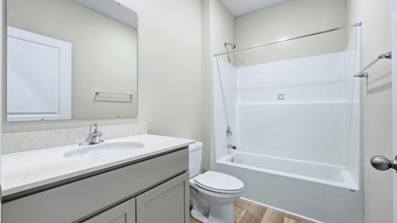 full bathroom with single vanity sink and tub shower