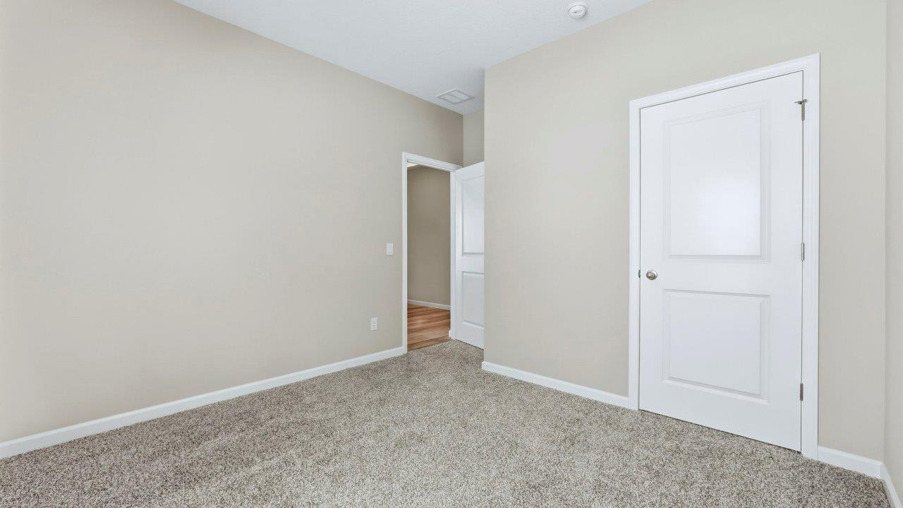 bedroom 3 with carpet, single window, and closet