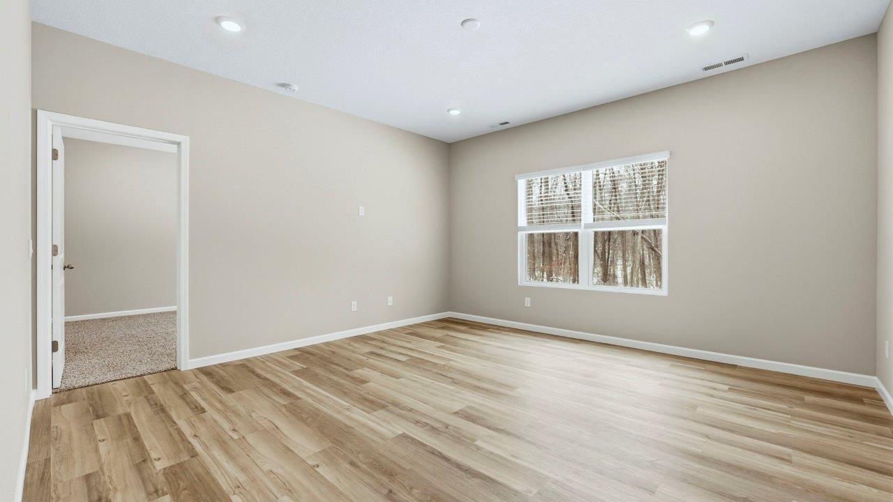 living room open plan with LVP flooring, 2 windows, and popular grey walls