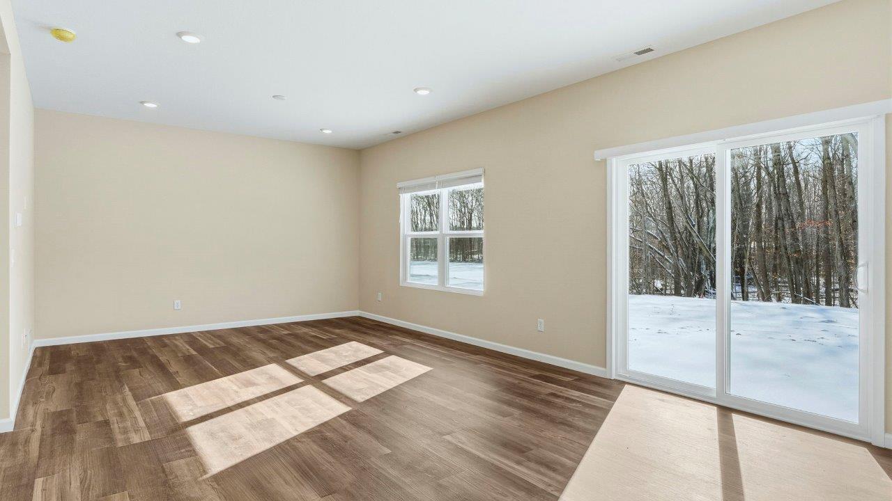 casual dining space with Mohawk Eastmont LVP and sliding door to backyard patio