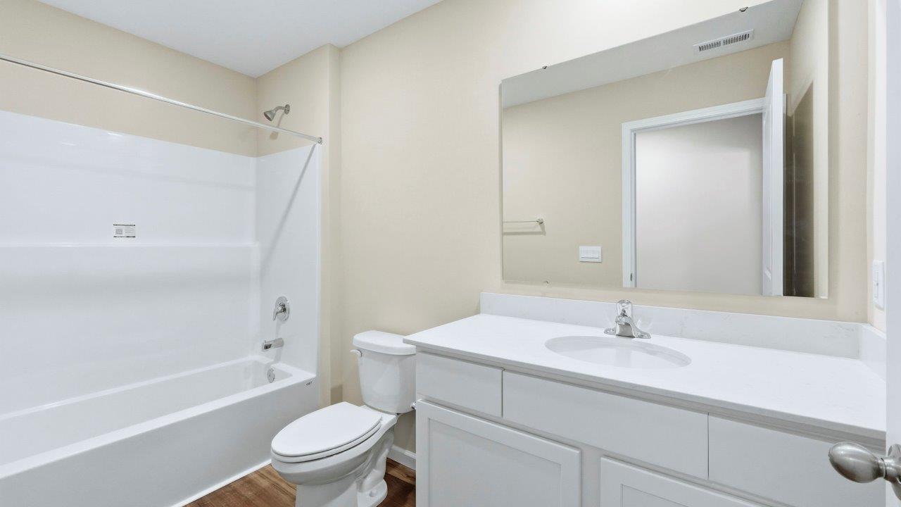 full bath with vanity sink and tub shower