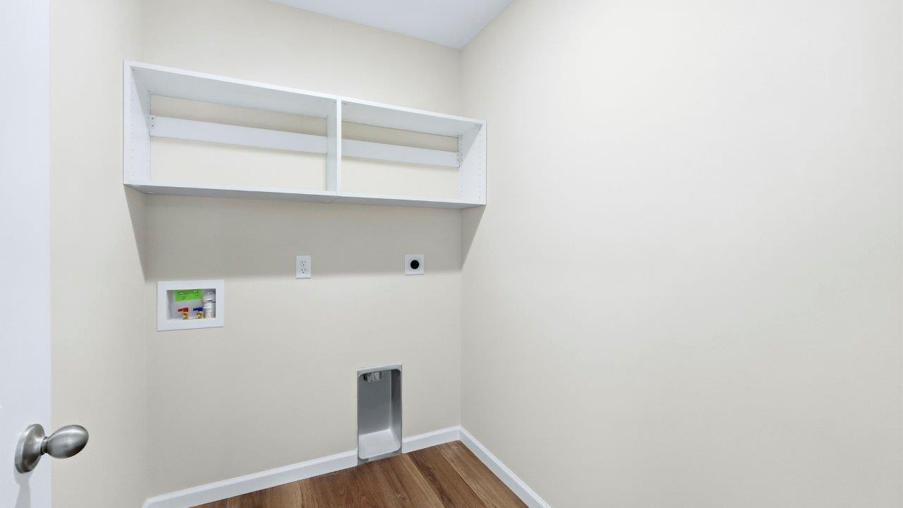 laundry room with shelving built-in, LVP flooring, and appliance hookups