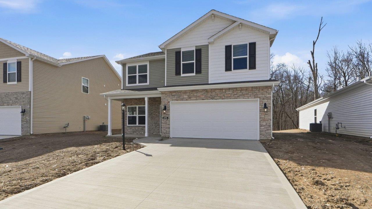 belmont woods bellamy plan with 2 car garage and covered patio