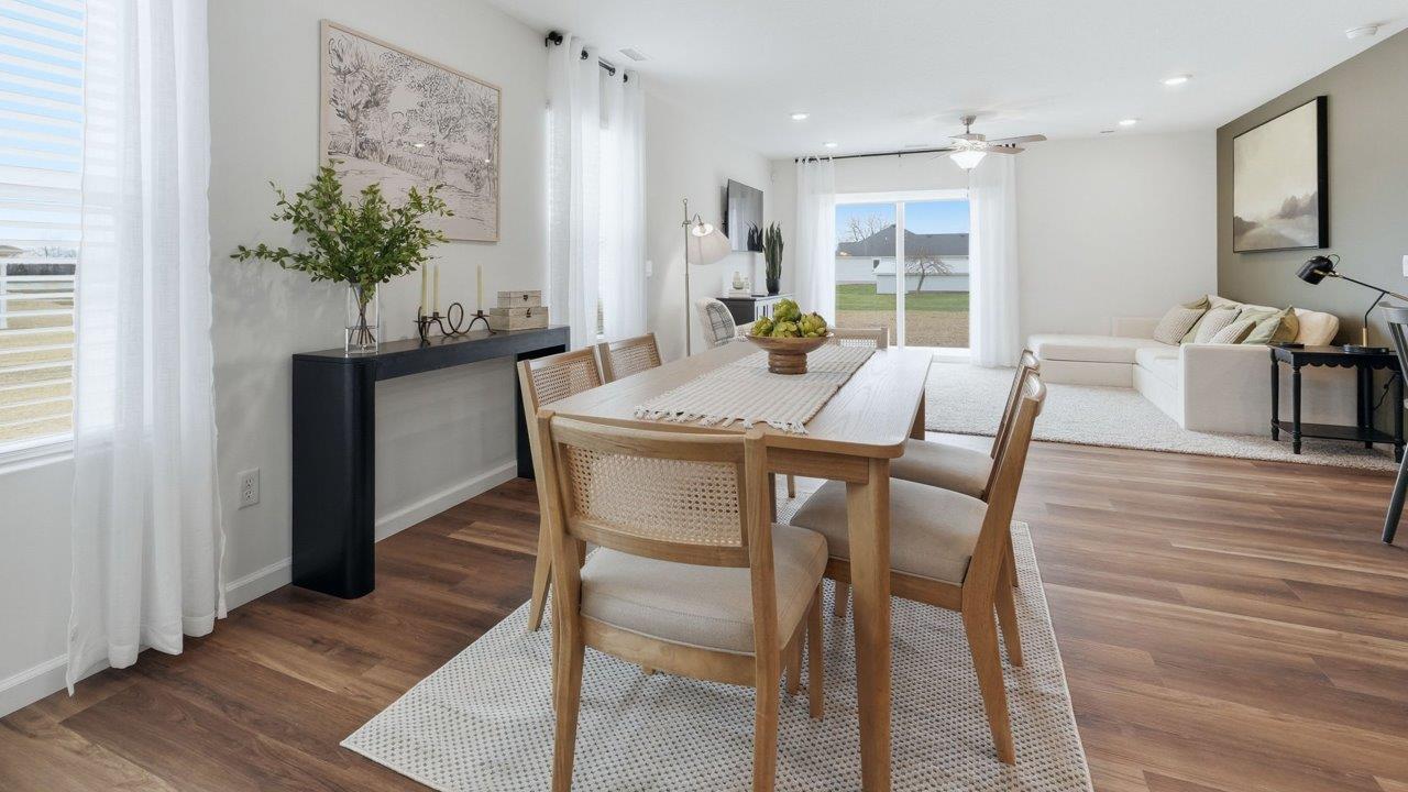 thunderhawk elm model home dining room with mohawk lvp flooring