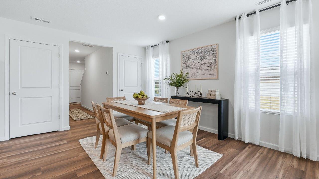 thunderhawk elm model home dining room with mohawk lvp flooring