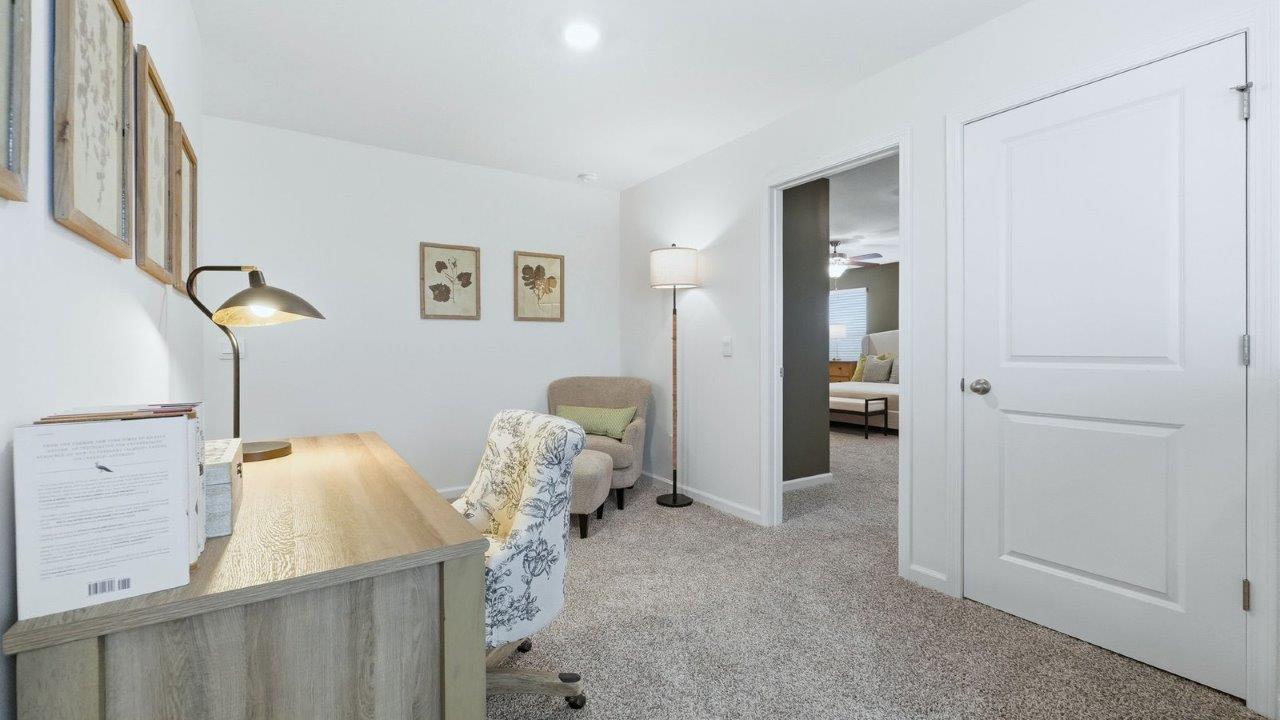 thunderhawk model home elm plan second floor top of stairs loft space furnished as home office