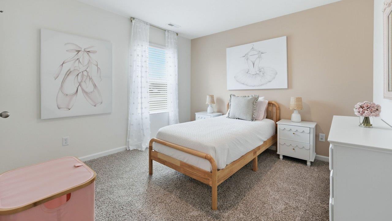 thunderhawk elm model home bedroom 3 with carpet flooring and pink walls