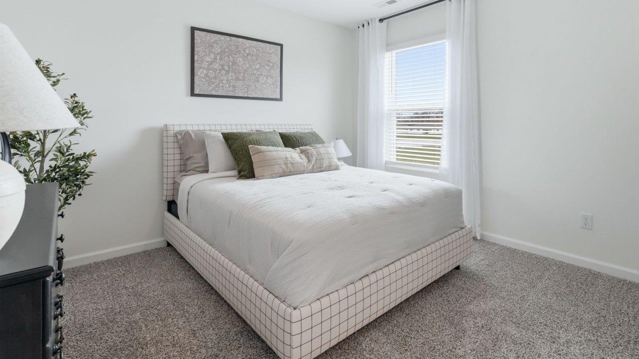 thunderhawk elm model home bedroom 4 with carpet flooring and white walls