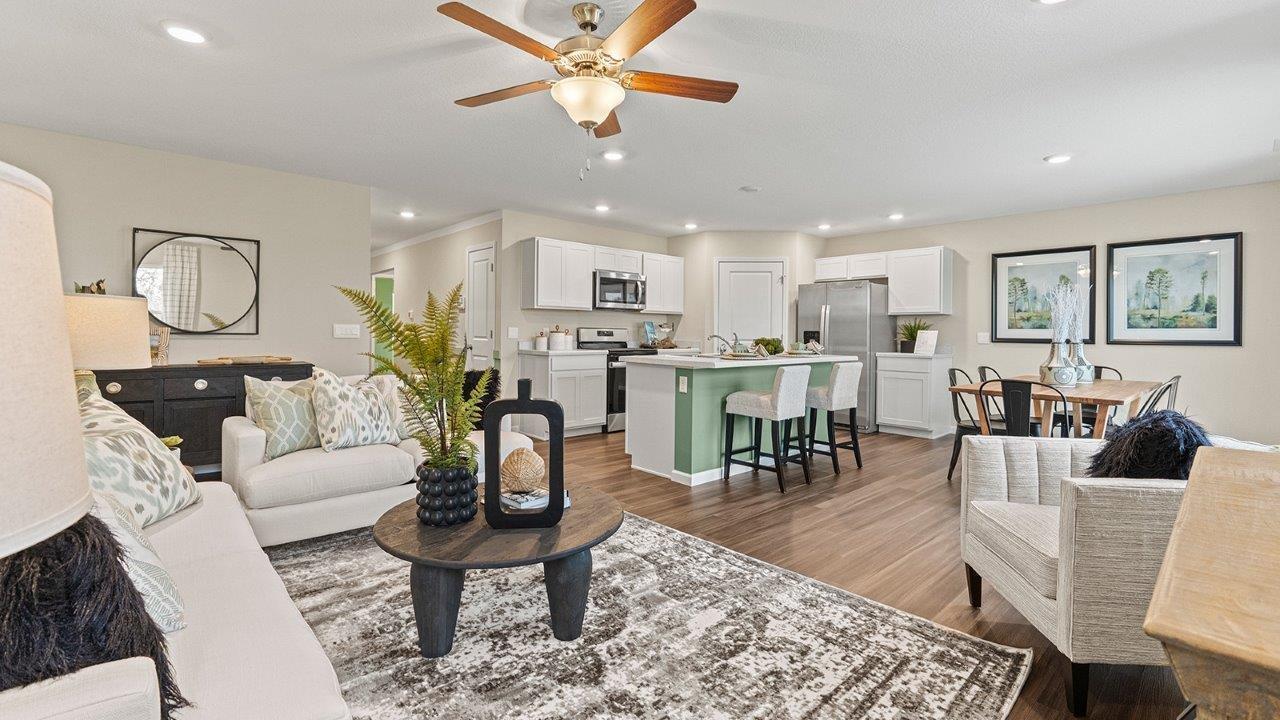 harmony living room with fan, 2 windows, and lvp flooring
