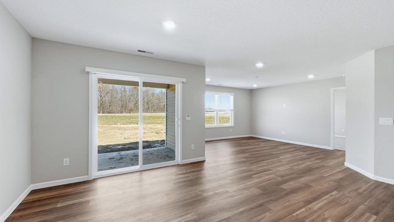 dining room with lvp and sliding glass door to backyard patio