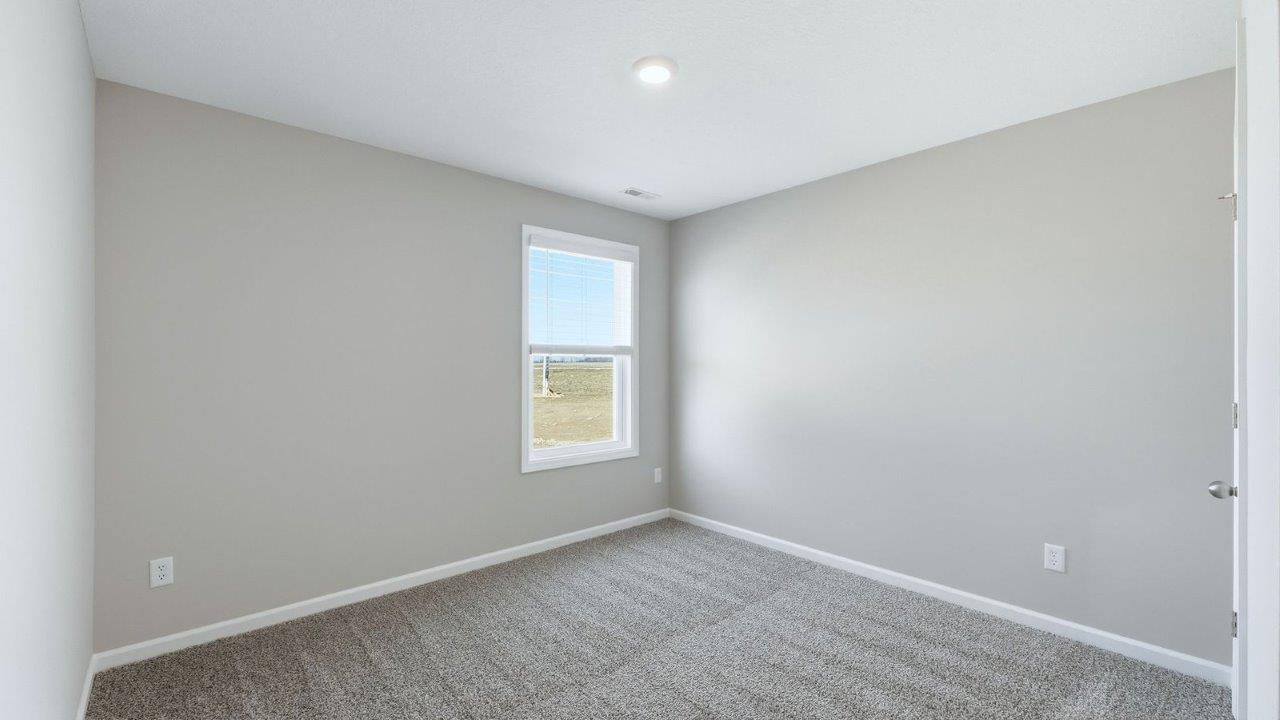 bedroom 3 with beige carpet, 1 windows, and popular grey walls